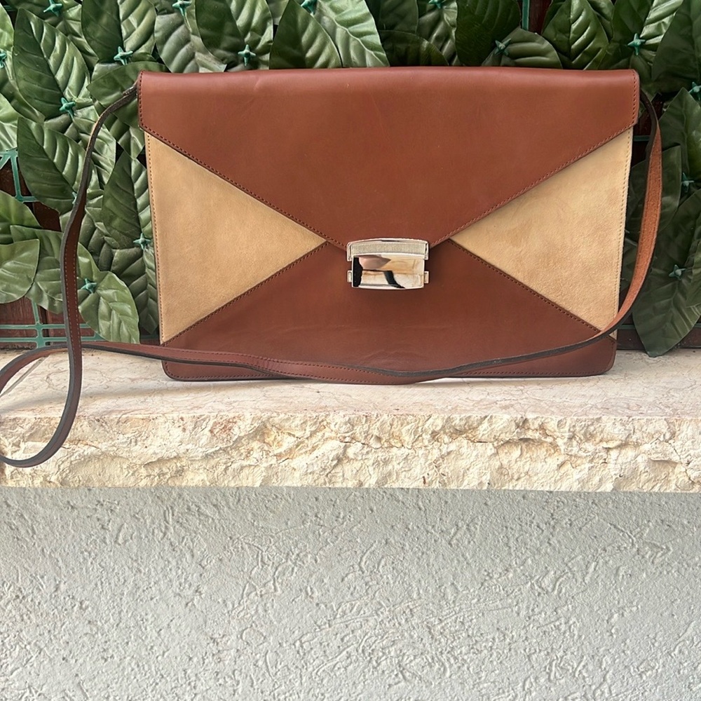 Beautiful clutch in chestnut leather with suede decoration